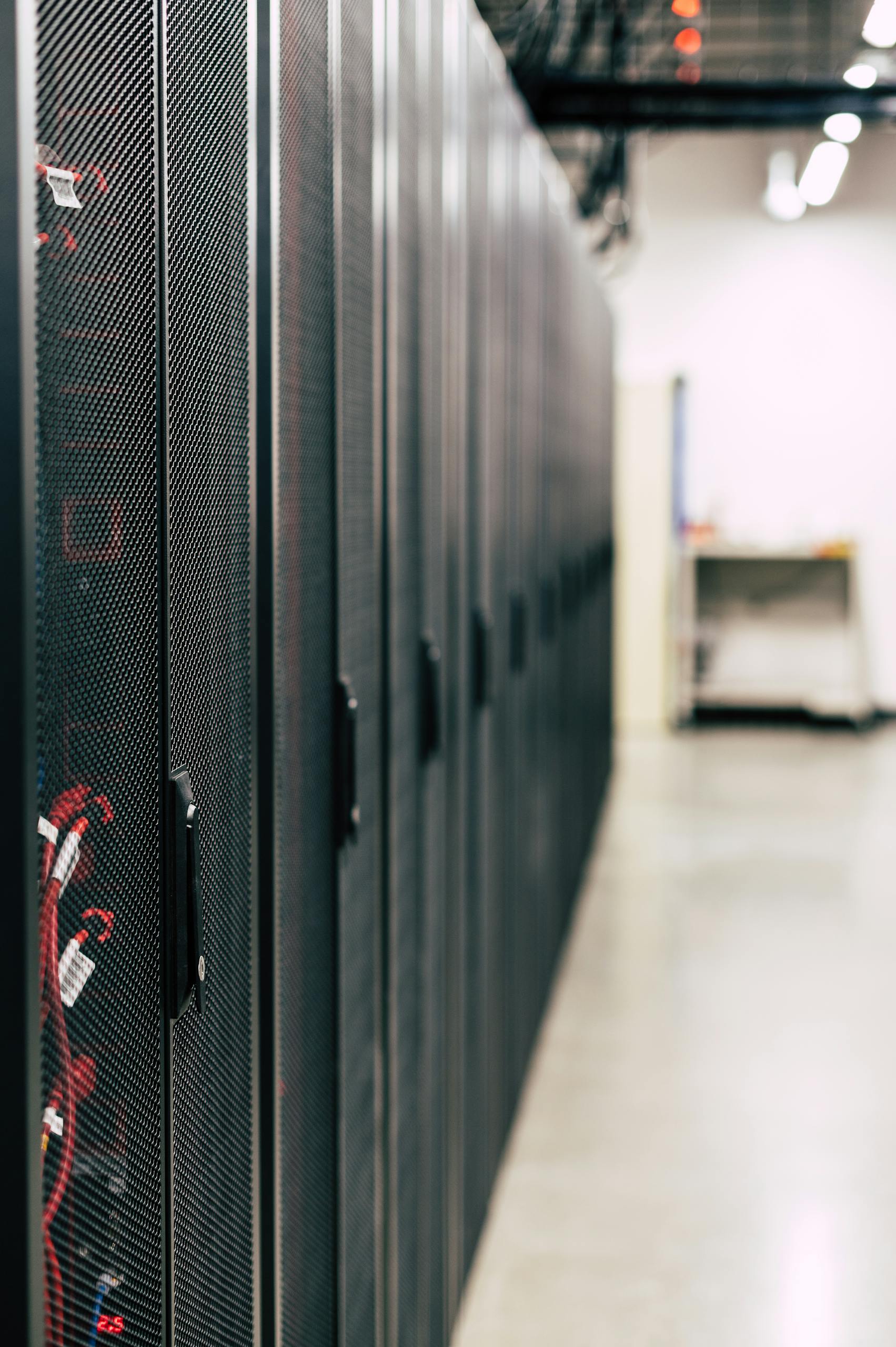 High-tech data center featuring multiple server racks with advanced equipment.